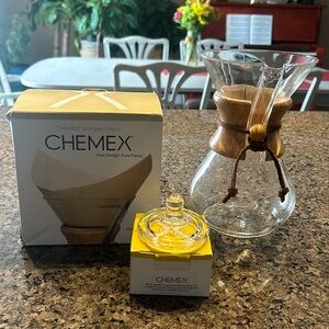 Chemex glass pour over coffee pot with 25 filter and glass top.
